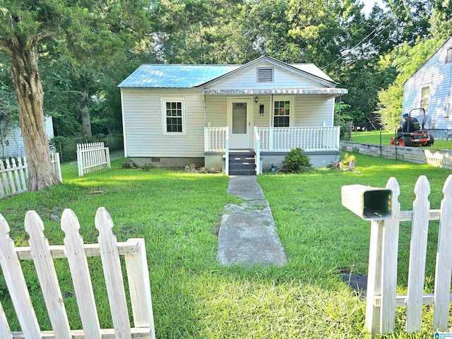 bungalow-style home with a porch and a front lawn