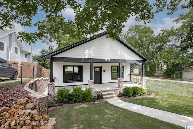 view of front of home featuring a porch and a front lawn