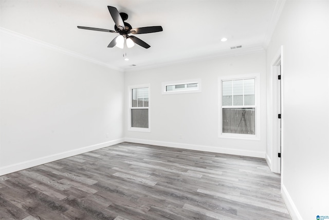 empty room featuring ornamental molding, ceiling fan, and hardwood / wood-style floors