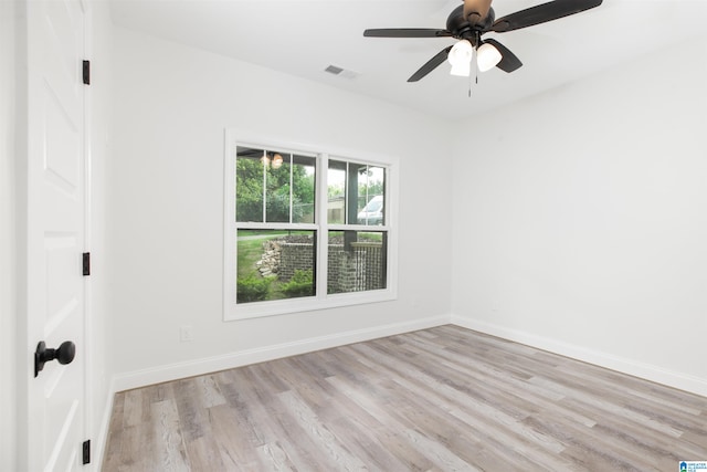 empty room with light hardwood / wood-style floors and ceiling fan