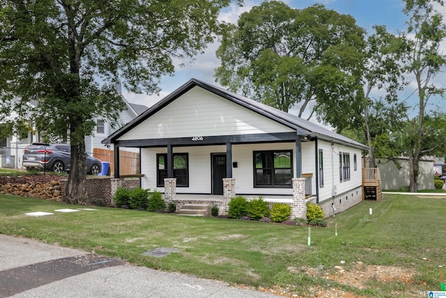 view of front of property featuring a porch and a front yard