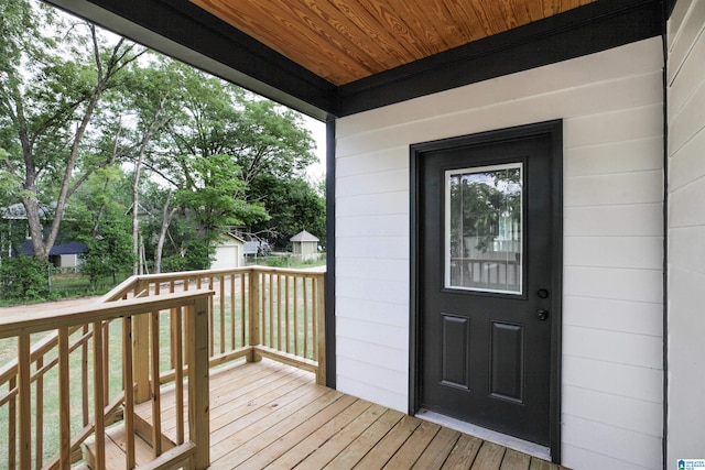 property entrance with a deck