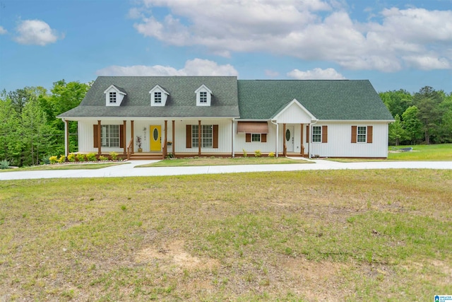 view of front of property with covered porch and a front lawn