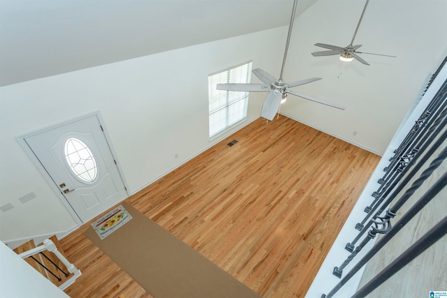 entryway featuring light hardwood / wood-style flooring, ceiling fan, and high vaulted ceiling