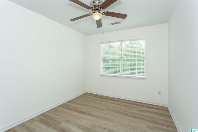 unfurnished room featuring light hardwood / wood-style flooring and ceiling fan