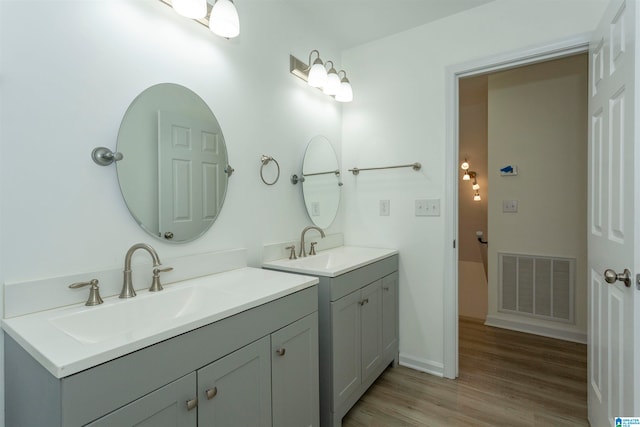 bathroom with vanity and hardwood / wood-style floors