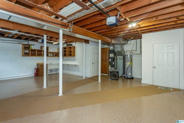 basement featuring heating unit and electric water heater