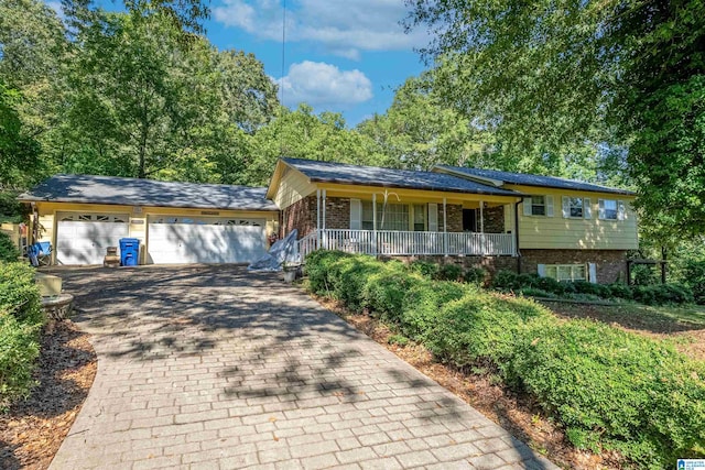 view of front of property featuring a garage and covered porch