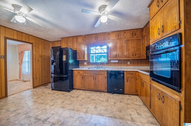 kitchen featuring black appliances, ceiling fan, a textured ceiling, and sink