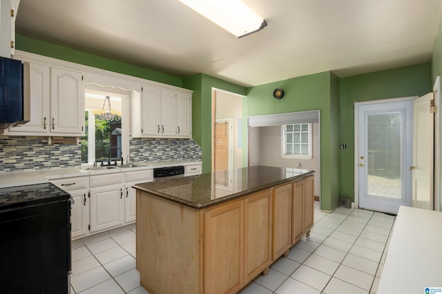 kitchen featuring white cabinetry, a center island, dishwasher, range with electric cooktop, and decorative backsplash