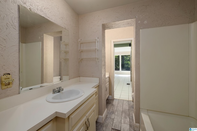 bathroom with vanity and wood-type flooring