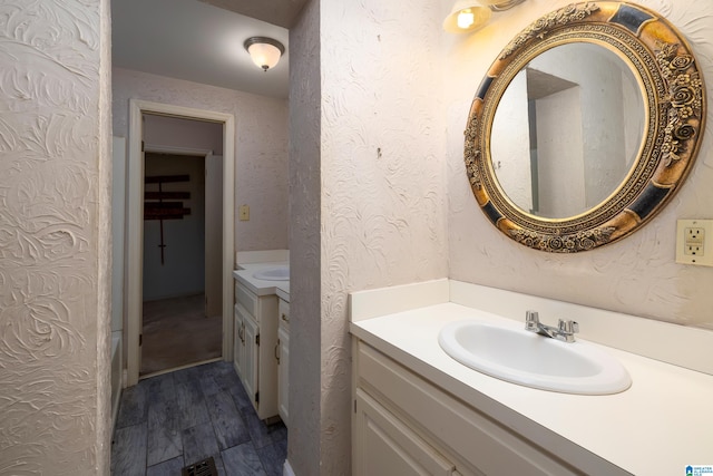 bathroom with vanity and wood-type flooring