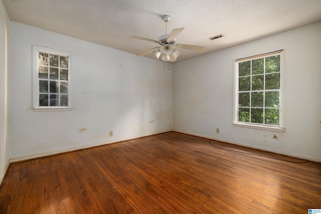 unfurnished room featuring a textured ceiling, ceiling fan, and wood-type flooring