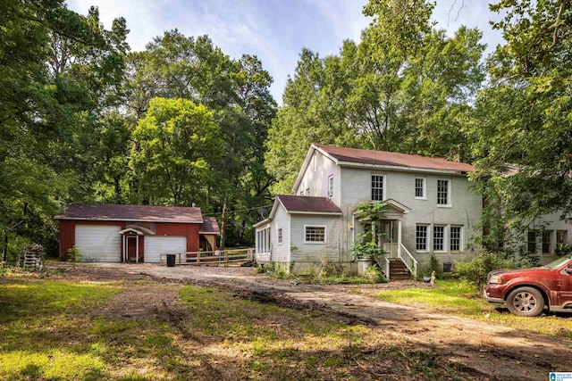 view of front of property featuring an outbuilding