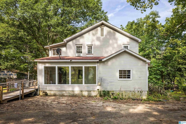 back of house featuring a deck