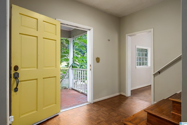 entryway featuring parquet flooring