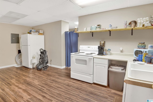 kitchen featuring a paneled ceiling, sink, dark hardwood / wood-style flooring, electric panel, and white appliances