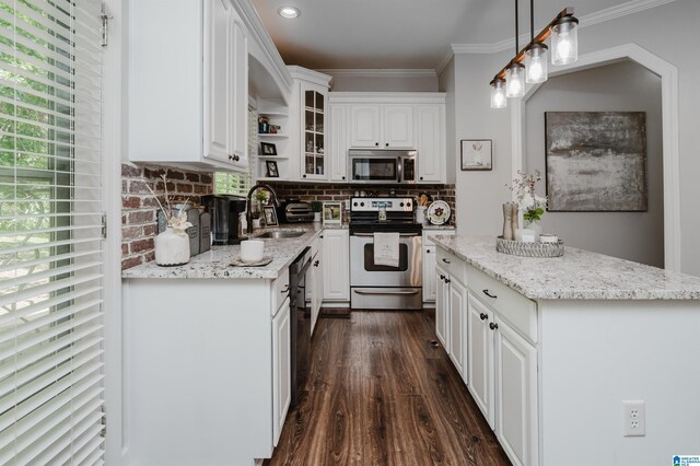 kitchen with white cabinetry, light stone countertops, appliances with stainless steel finishes, and sink