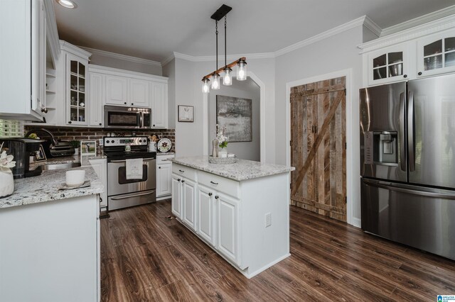 kitchen with white cabinetry, stainless steel appliances, dark hardwood / wood-style flooring, and a kitchen island