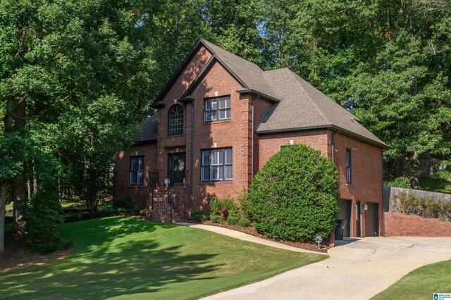 rear view of house featuring a yard and a patio area