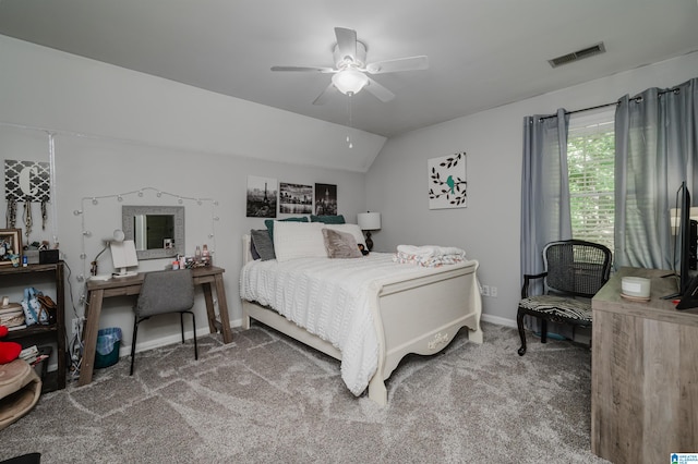 carpeted bedroom featuring ceiling fan and vaulted ceiling