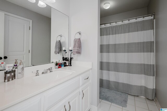 bathroom with tile patterned flooring and vanity