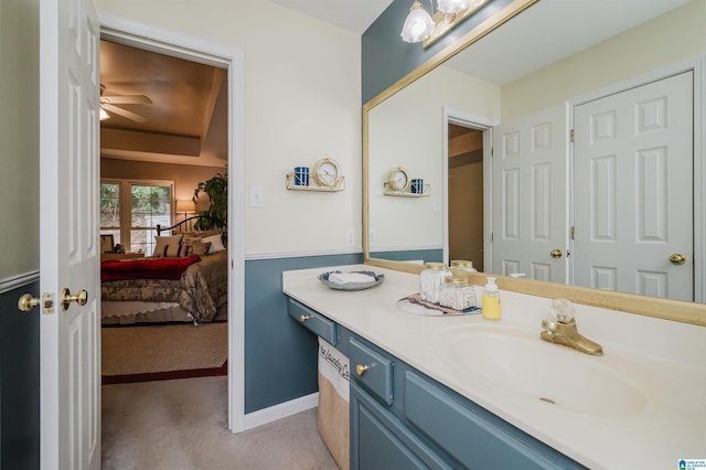 bathroom featuring ceiling fan and vanity