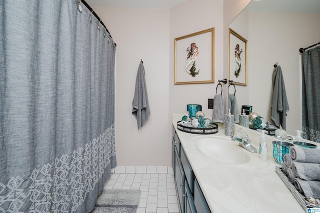 bathroom with tile patterned flooring and vanity