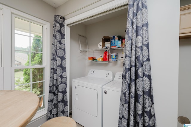 laundry room with washing machine and dryer