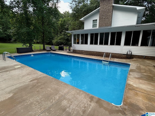pool featuring a sunroom
