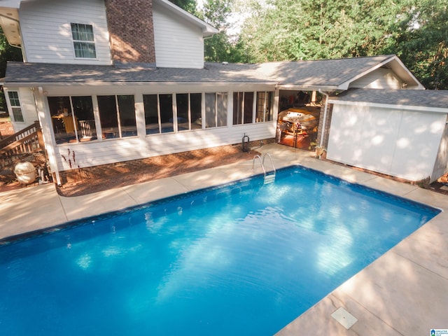pool featuring a sunroom