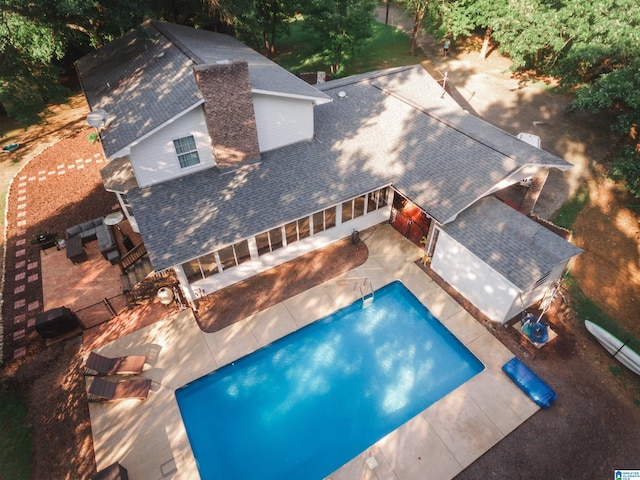 exterior space with a fenced backyard, outdoor lounge area, a patio, and a fenced in pool
