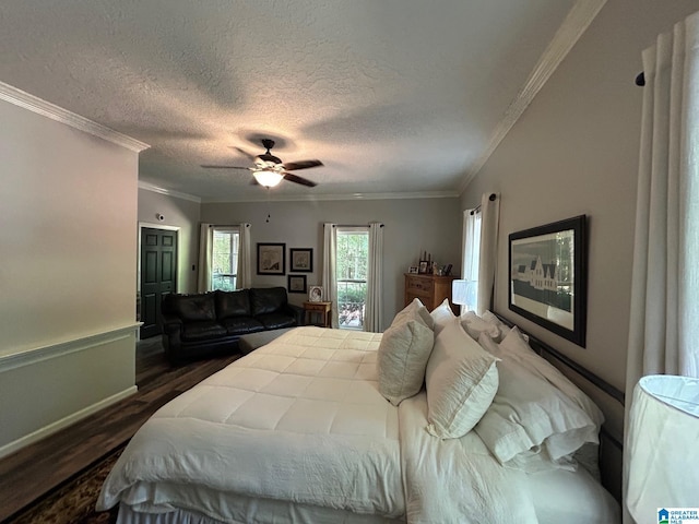 bedroom featuring ceiling fan, crown molding, a textured ceiling, and dark wood-style floors