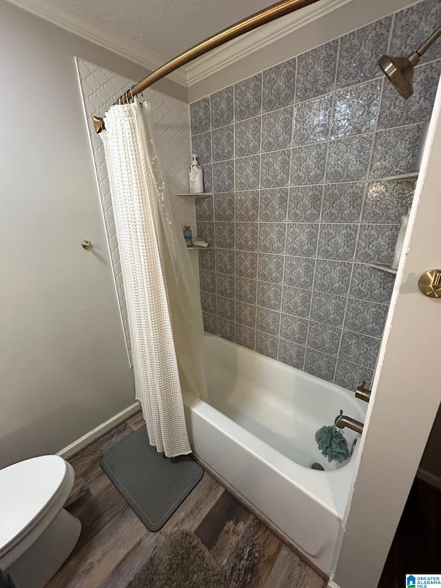 full bath with toilet, ornamental molding, shower / tub combo with curtain, and wood finished floors