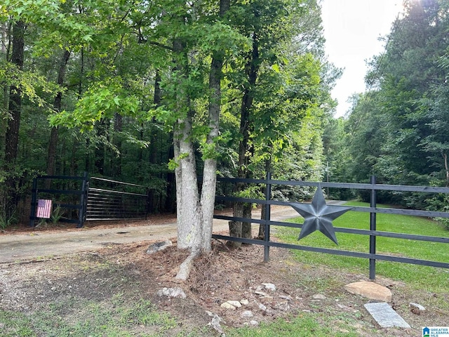 view of gate featuring fence