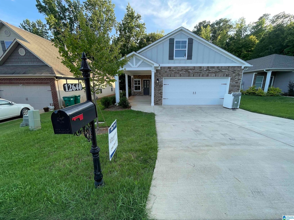 view of front facade with a garage and a front lawn