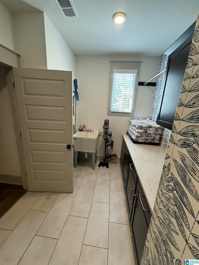 bathroom with tile patterned floors