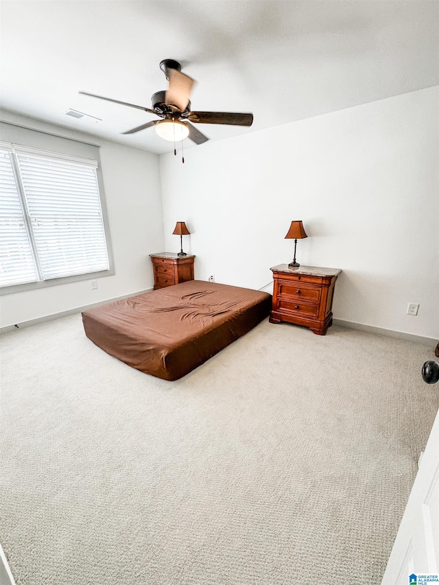 carpeted bedroom featuring ceiling fan