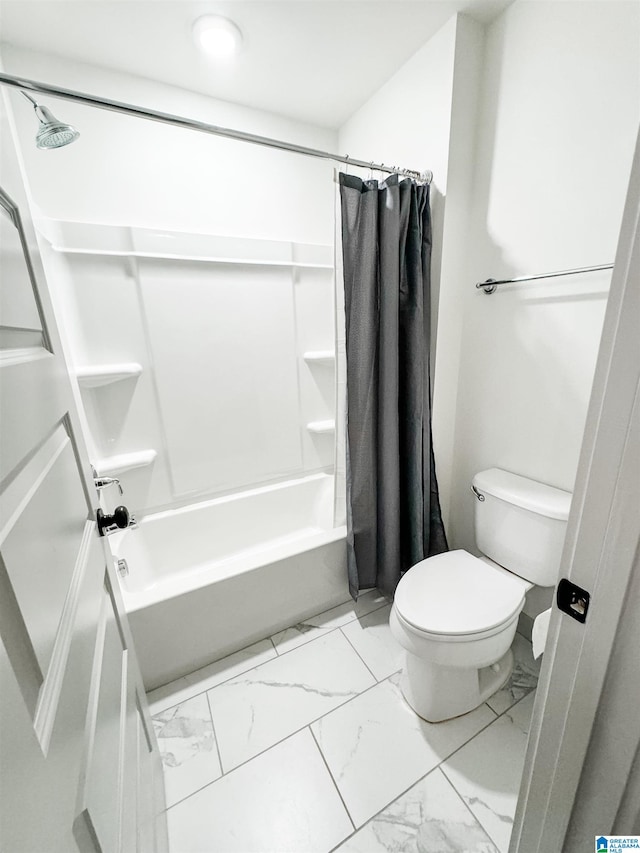 bathroom featuring toilet and shower / bath combo with shower curtain