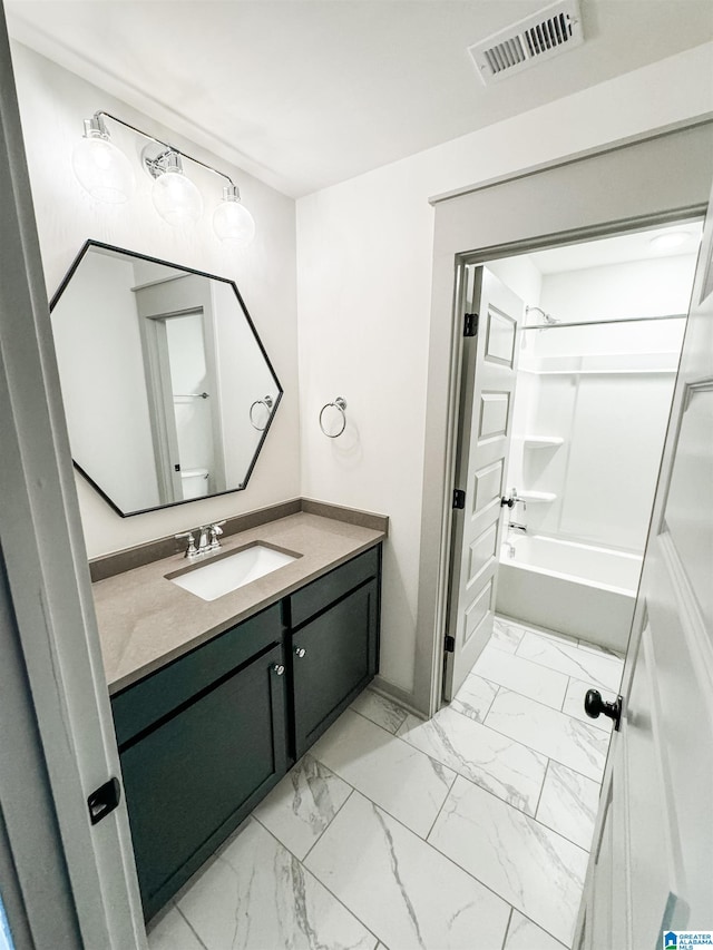 bathroom with washtub / shower combination and vanity