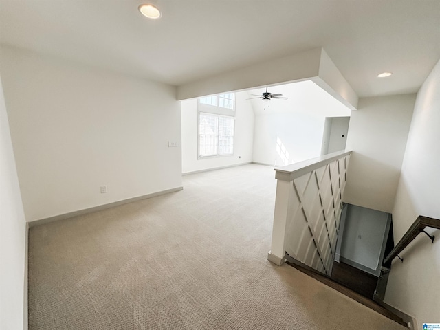 interior space with ceiling fan and carpet flooring