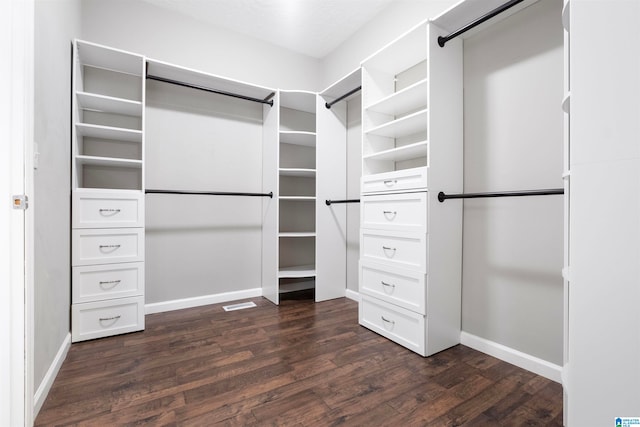 walk in closet featuring dark hardwood / wood-style flooring