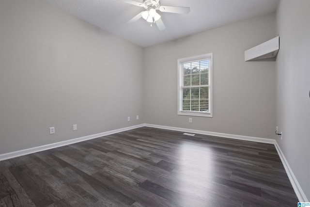 unfurnished room featuring dark hardwood / wood-style floors and ceiling fan