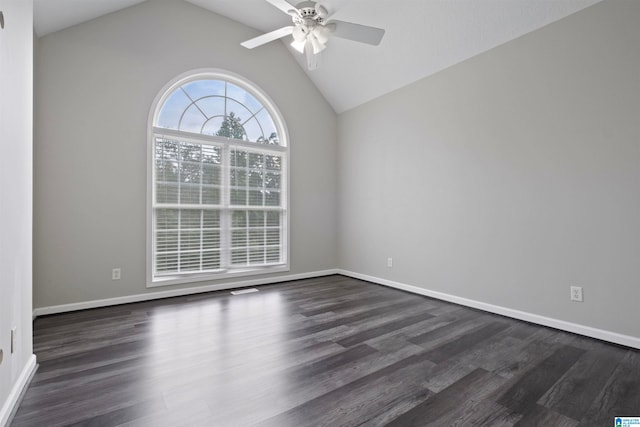 spare room featuring ceiling fan, hardwood / wood-style flooring, and vaulted ceiling