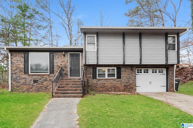 tri-level home featuring a garage and a front lawn