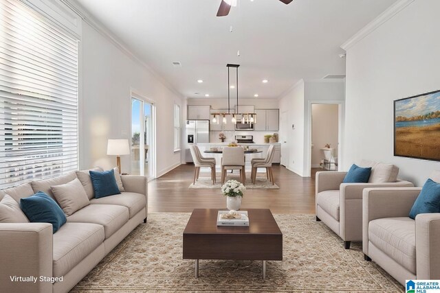 unfurnished living room featuring ceiling fan, dark hardwood / wood-style flooring, and crown molding