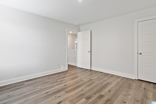 spare room with light hardwood / wood-style flooring