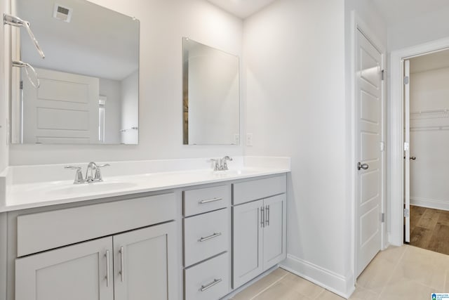 bathroom featuring vanity and hardwood / wood-style flooring