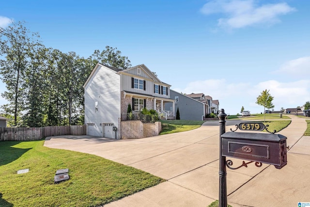 view of front of house with a garage and a front lawn