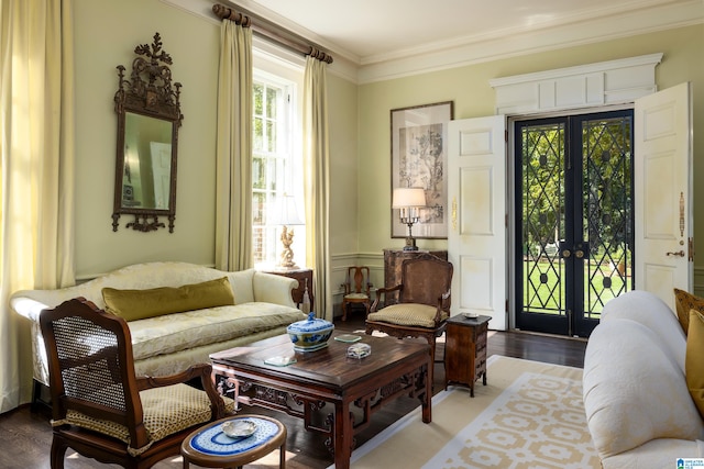 living room featuring crown molding, french doors, and wood-type flooring